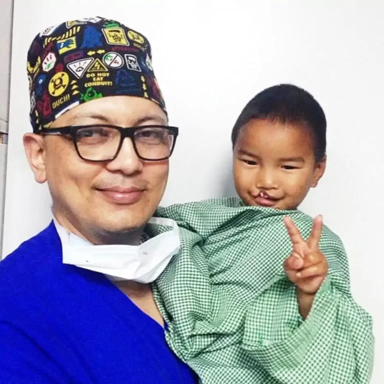 Dr. Rajib with a claft patient.