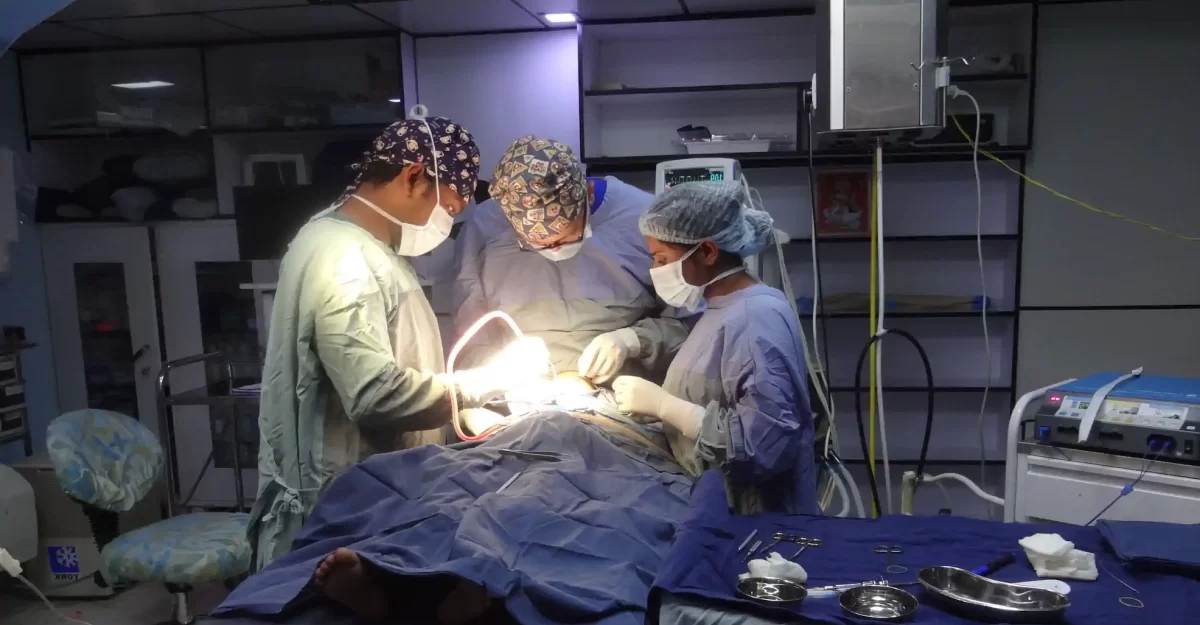 Dr. Rajib and team performing surgery.